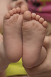 © Oleksandr - Baby's foot in mother hands closeup