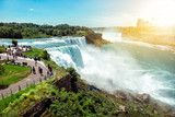American side of Niagara falls, NY, USA. Tourists enjoying beautiful view to Niagara Falls during hot sunny summer day..