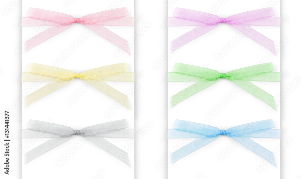 Set of multi-colored capron ribbons with a bow isolated on white ...