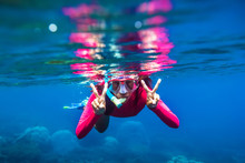 Underwater Swimming In Blue Ocean