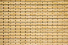 High Resolution Texture Of A Yellow Brick Wall. Laying Horizonta