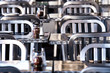 © mikesjc - meal tables and chairs with salt and pepper shakers at outdoor restaurant