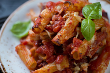 Wall Mural - Closeup of cooked italian ziti on a glass plate, selective focus