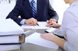 © rogerphoto - Bookkeepers or financial inspector making report, calculating or checking balance. Audit concept.