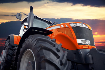Poster - Tractor on a background cloudy sky