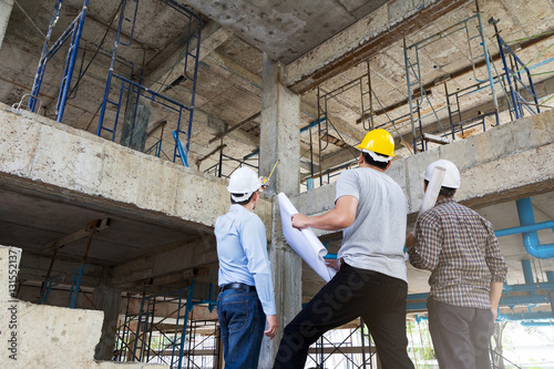 Fotografie, Obraz Engineer, foreman and worker discussing in building construction site