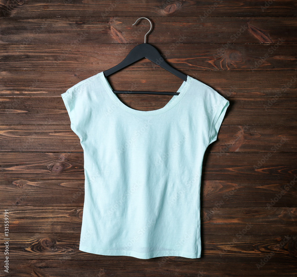 Blank color t-shirt against wooden background