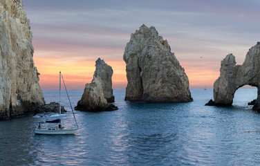 Beautiful Dramatic Seascape view of the ocean with colorful sunset and  sailboats - Cabo san Lucas,  Mexico