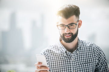 Canvas Print - Bearded man using cellphone