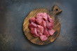 Raw chopped beef on a wooden cutting board.Top view.