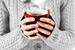 © Alextype - hot red cup in woman's hands