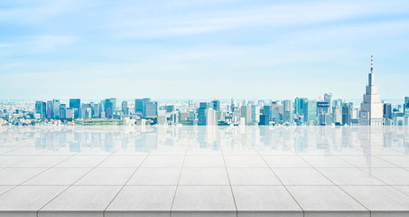 Wall Mural - Business concept - Empty concrete floor top with panoramic modern cityscape building bird eye aerial view under sunrise and morning blue bright sky of Tokyo, Japan for display or montage product