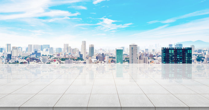 Business concept - Empty concrete floor top with panoramic modern cityscape building bird eye aerial view under sunrise and morning blue bright sky of Tokyo, Japan for display or montage product