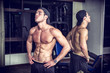 © theartofphoto - Muscular young man resting in gym during workout
