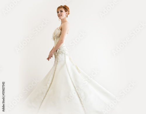 Beautiful Young Redhead Bride Wearing White Wedding Dress With