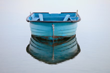 Wooden Fishing Boat On A Background Of Water