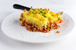 Traditional british shepard pie on white plate