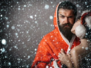 Santa bearded man and pretty girl