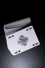 poker card stack deck on dark black background