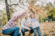 © chika_milan - Dad, mom and son flying a kite in nature