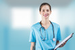 beautiful woman nurse or doctor is holding a notepad board with copy space for advertising
