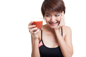 Wall Mural - Beautiful healthy Asian girl like tomato juice.