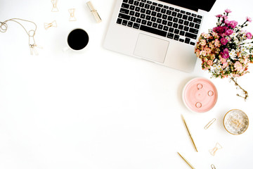 Wall Mural - Top view home office desk. Workspace with laptop, wildflowers bouquet, coffee cup, golden pen, clips and accessories. Flat lay