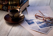 Books, Coffee Cup And Poems On The Old Wooden Table. Shakespeare Poems