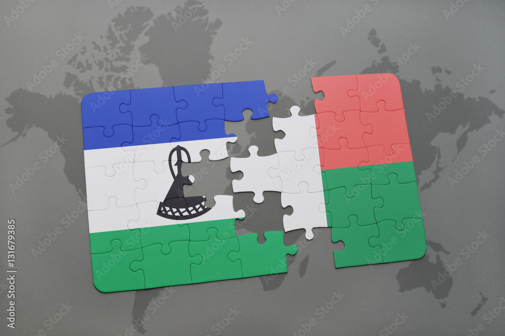 puzzle with the national flag of lesotho and madagascar on a world map ...