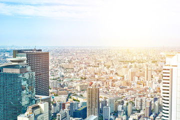 Asia Business concept for real estate and corporate construction - panoramic modern cityscape building bird eye aerial view under sunrise and morning blue bright sky in Tokyo, Japan