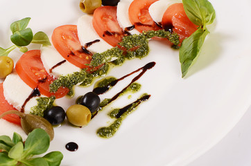 Wall Mural - Tomatoes and mozzarella cheese sliced olives