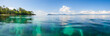panoramic shot over water of tropical beach.