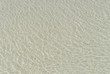 watery texture with sand background  in the Xpu-Ha beach on the beach of the Caribbean sea of Mexico