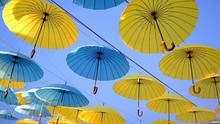 Umbrella Blue And Yellow Heap On Blue Sky On The Wind In Sunny Day 