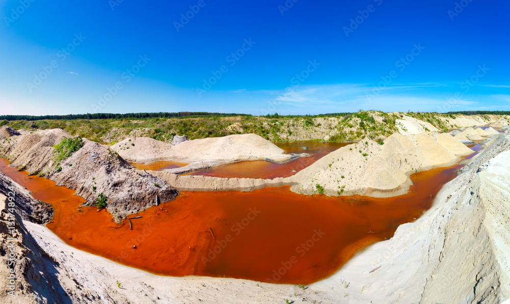 sand quarry filled with water saturated minerals - obrazy, fototapety, plakaty 