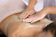 © Africa Studio - Young woman receiving scrub massage in spa salon