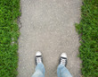 Feet on the pavement.