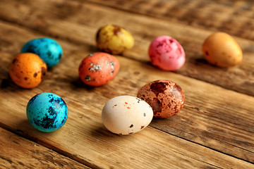 Wall Mural - Beautiful Easter eggs on wooden background