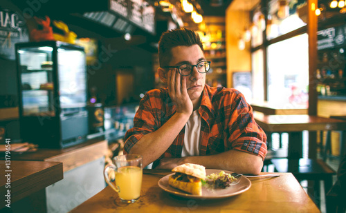 Fotomural Man has no appetite in the restaurant