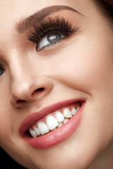 Wall Mural - beauty makeup. closeup beautiful woman face with perfect smile