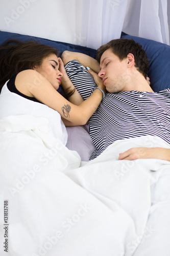 Beautiful Couple Sleeping And Resting On Bed All Together