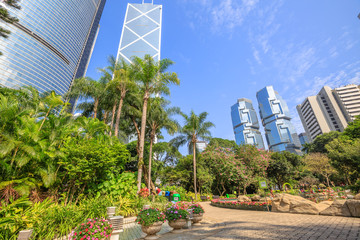 Hong Kong skyline of modern skyscrapers and towers in Central business district in a sunny day with blue sky seen from the Hong Kong Park, China, Asia.