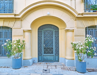 athens greece, elegant house arch entrance with flowerpots