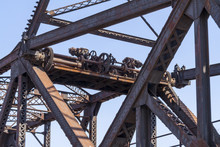 Close-up Of Railway Tressel Metal Beams And Gears