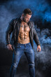 © theartofphoto - Man pointing gun to camera, wearing jacket on naked torso