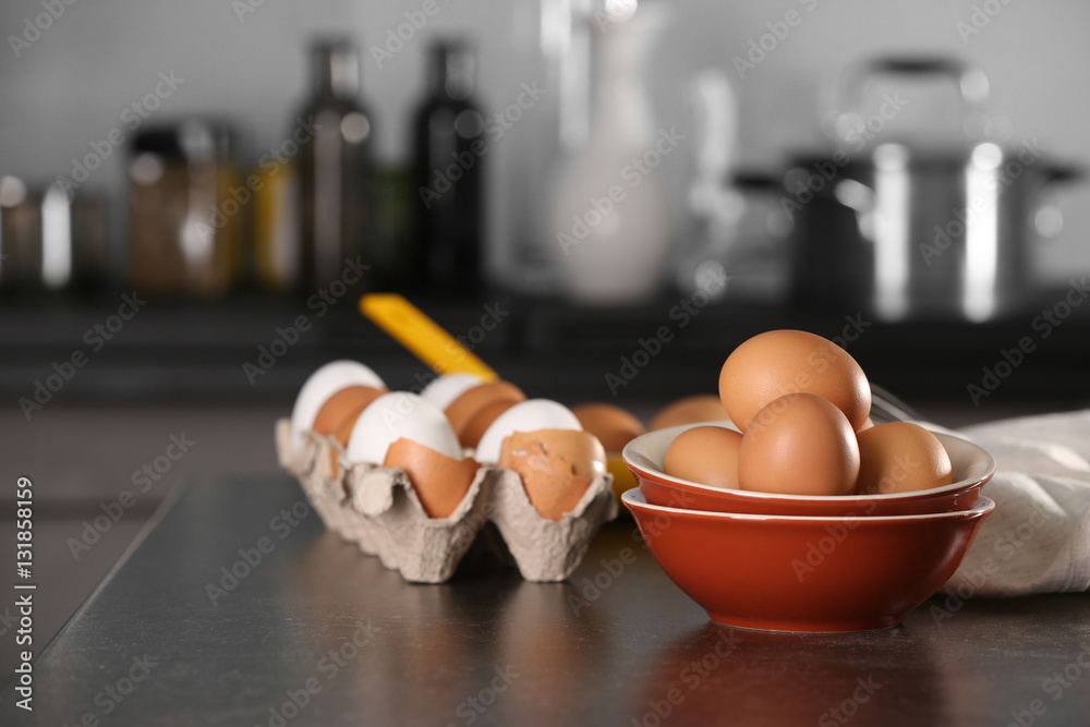 Raw eggs on kitchen table