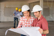 © livertoon - foreign Investor talking salesperson about the construction proj