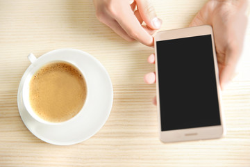 Wall Mural - Man using smart phone in cafe