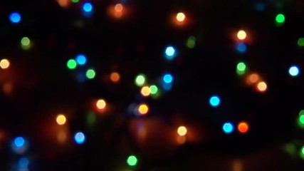 blurry abstract colorful background. colored christmas garland. bokeh and defocusing of the lens
