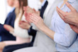© rogerphoto - Close up of business people hands  clapping at conference
